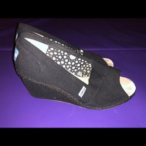 Black canvas and black heel Toms wedges.